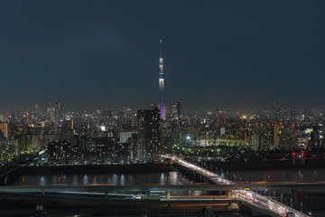 Fototapeta na wymiar Scene of Tokyo sky tree over the downtown cityscape with express way and river, Japan