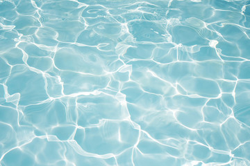 Texture of water in swimming pool for background