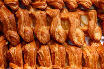 Fresh pastries in a wicker tray top view