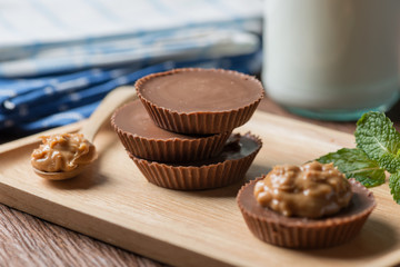 Homemade peanut butter cup, dark chocolate, dessert food.