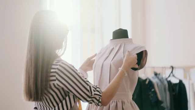 the designer adjusts sleeve blouse.