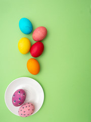 Easter eggs painted on green background
