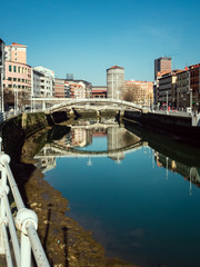 Bridge of the Ribera de Bilbao on a sunny day, vertical
