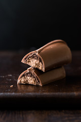 Tiramisu Flavored Chocolate Bar on Dark Wooden Surface.