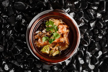 Bowl of ramen on black