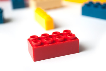 closeup of plastic bricks construction on white background