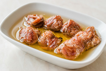 Marinated Canned Anchovy Fillet in Bowl / Anchovies served with Black Pepper on Marble Board.