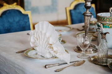 A baroque table setting in the castle. Luxury interior.