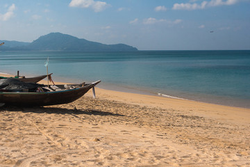 Naklejka na ściany i meble Wooden fishing boat on the Andaman Sea in Thailand