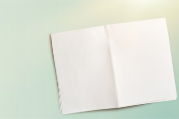 Close up of a crumpled unfolded piece of paper on white background
