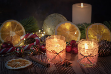 Christmas decorated Burning candles on wooden rustic background with christmas decoration