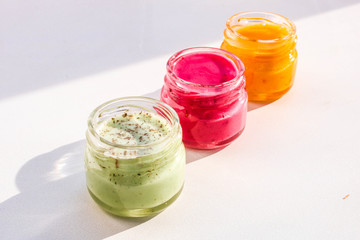Multi-colored jars with honey souffle.