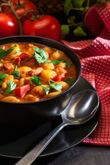 White bean soup with potatoes, tomatoes, paprika, and bacon