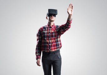 Guy in mask experiencing virtual reality as new entertainment device