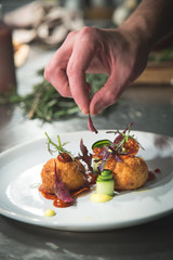final touches to crouton dish