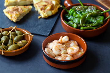 Authentic Spanish tapas with padron peppers and traditional tortilla