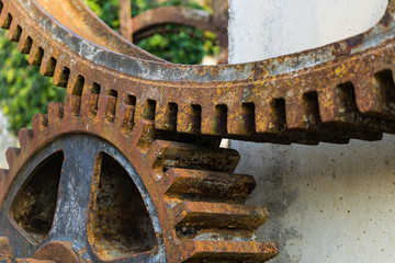 Old rusty waterwheel. Detail of the gears
