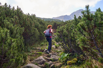 Woman hiking into the mountains
