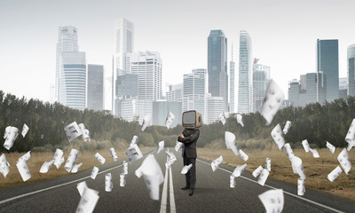 Businessman with old TV instead of head.