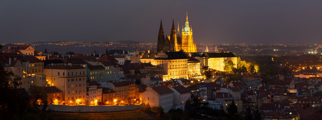 Prague - The panorama of the Town with the Castle and St. Vitus cathedral at dusk.