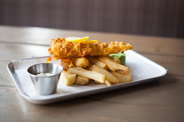 battered fish on tower of chips