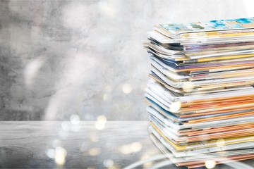 Pile of newspapers on white background