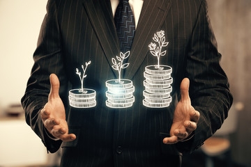 Double exposure with growth coins columns and man hand. Concept of success savings and capital.