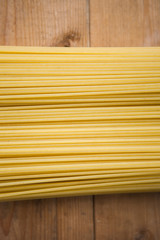 Spaghetti on the wooden ground, close up