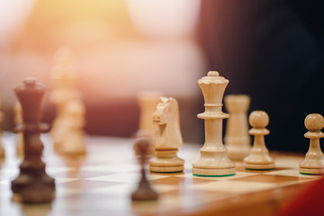Chess board with figures for game, highlight light