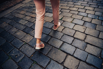 Top view of legs tourists woman in movement walking, concept being late for meeting, in hurry