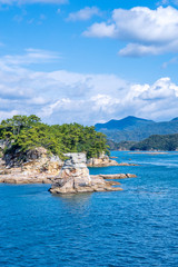 Many small islands over the blue ocean in sunny day, famous Kujukushima(99 islands) pearl sea...