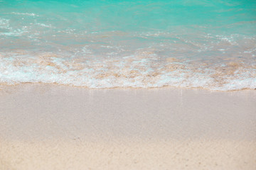 The layers of soft wave on sandy beach. Background of travel in summer