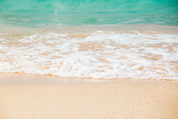 The layers of soft wave on sandy beach. Background of travel in summer