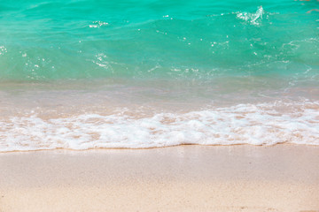 The layers of soft wave on sandy beach. Background of travel in summer