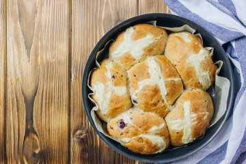 Traditional Easter treats cross buns wwith fresh butter
