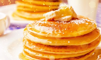 Stack of delicious pancakes with butter