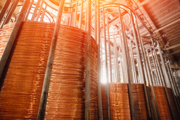 Production of copper wire, bronze cable in reels at factory