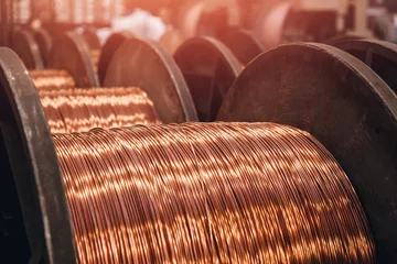 Foto op Plexiglas Production of copper wire, bronze cable in reels at factory © Parilov