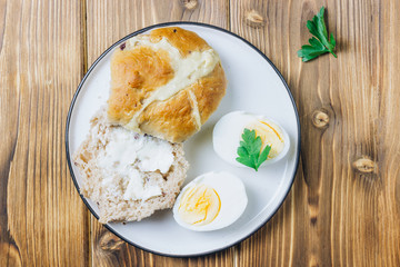 Traditional Easter treats cross buns wwith fresh butter