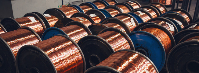 Production of copper wire, bronze cable in reels at factory - obrazy, fototapety, plakaty