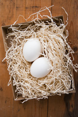 Two white eggs in the nest