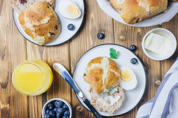 Traditional Easter treats cross buns wwith fresh butter