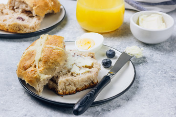 Traditional Easter treats cross buns wwith fresh butter