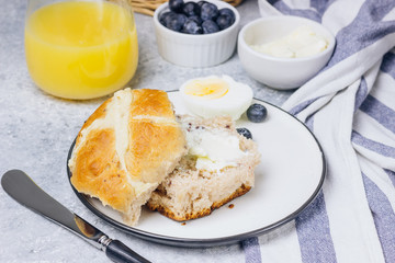 Traditional Easter treats cross buns wwith fresh butter
