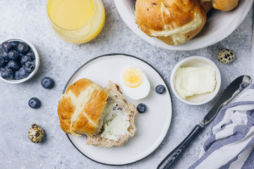 Traditional Easter treats cross buns wwith fresh butter