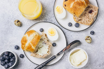 Traditional Easter treats cross buns wwith fresh butter
