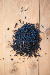 Tea leaves on a wood ground