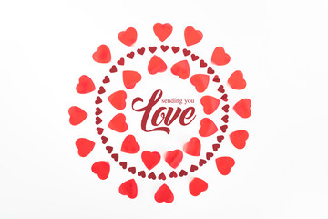 top view of circles made of red heart symbols isolated on white with 