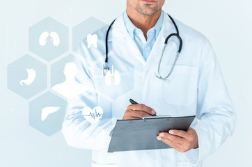 cropped image of doctor with stethoscope on shoulders writing something in clipboard isolated on white with medical interface