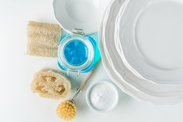 dish washing with zero waste brushes. sponges, soda and soap. flat lay minimalistic